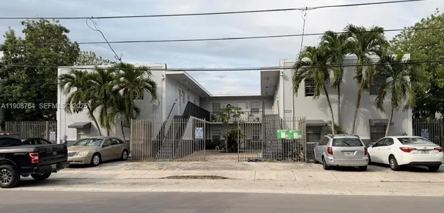 a view of a cars parked in front of a house