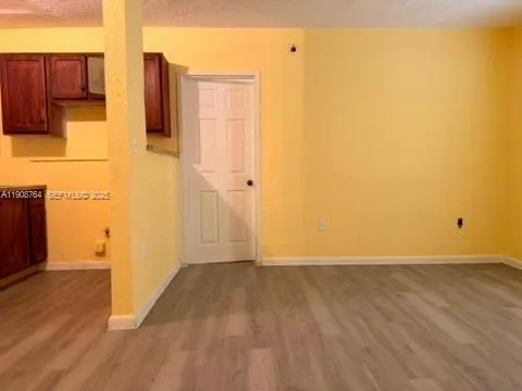a view of a storage & utility room with wooden floor