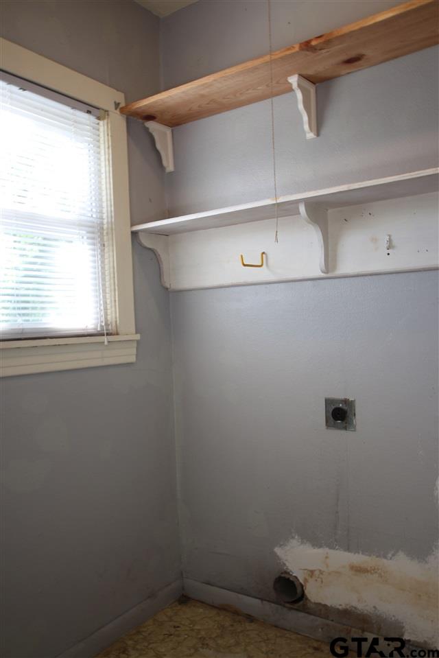 427 East 5th Street Tyler, TX 75701 - Photo 13 of 23 a view of a room with racks on the wall