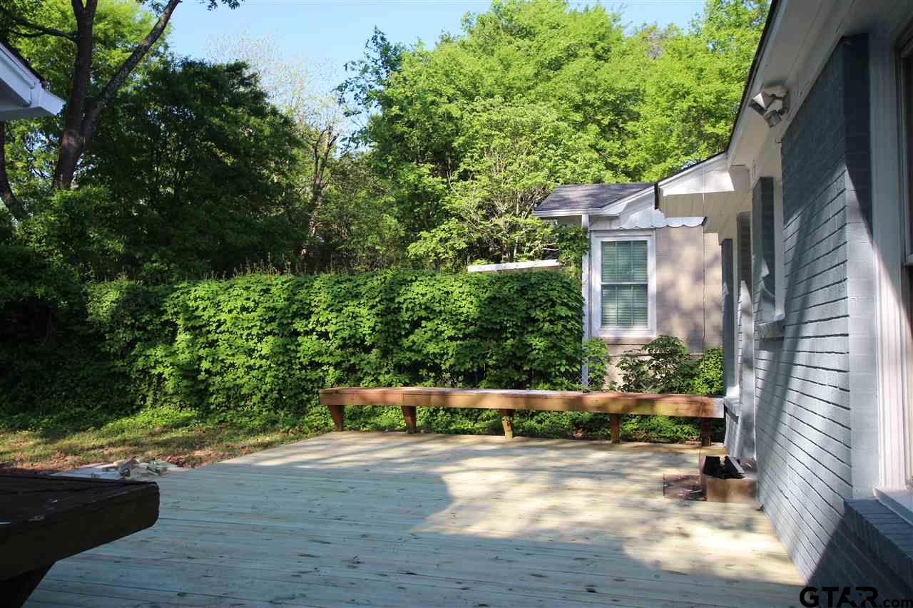 427 East 5th Street Tyler, TX 75701 - Photo 23 of 23 a backyard of a house with lots of green space