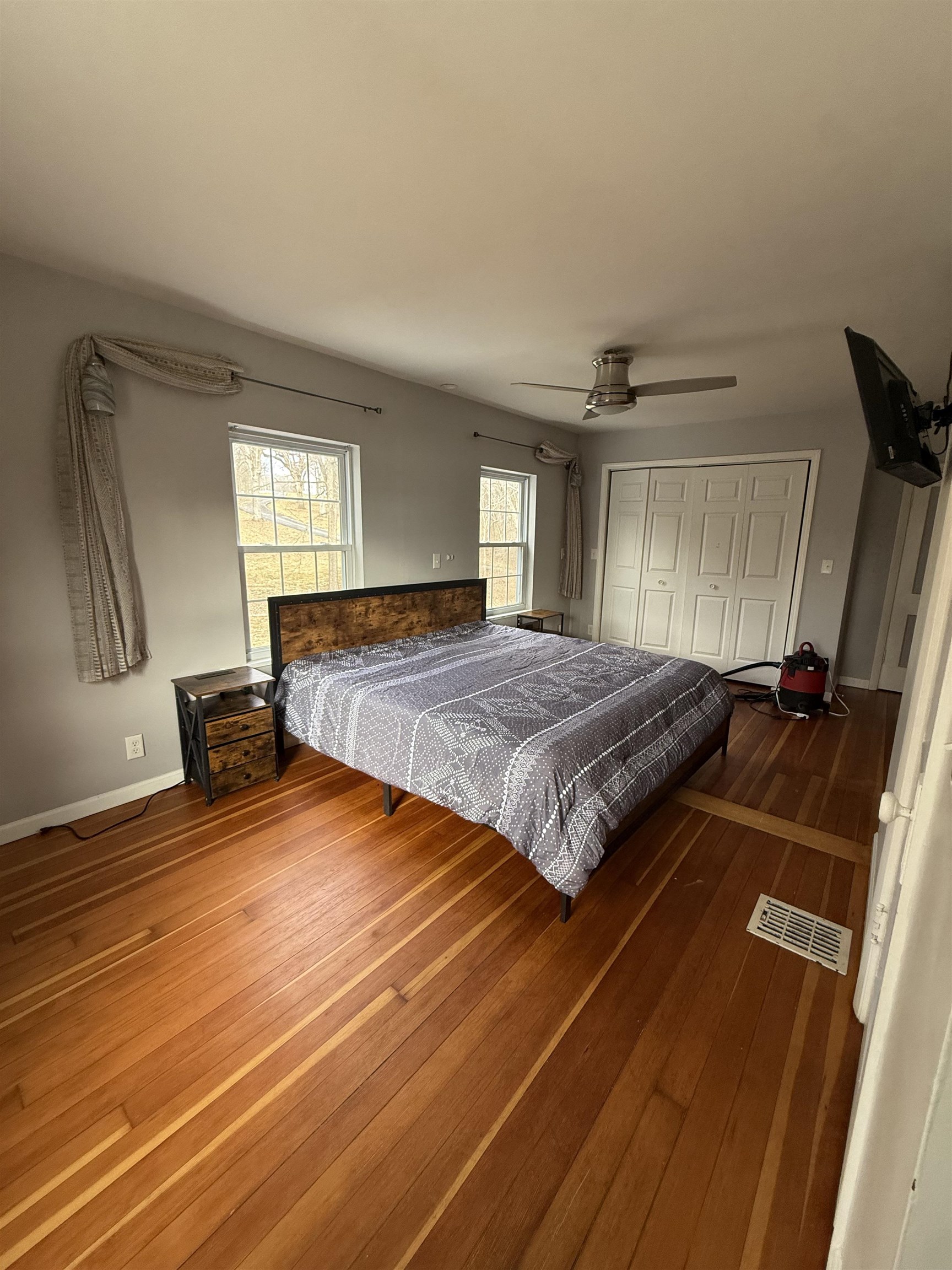 8894 North Il Route Byron, IL 61010 - Photo 10 of 13 a spacious bedroom with a bed and wooden floor