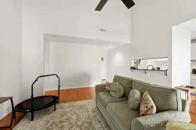 a living room with furniture and a rug