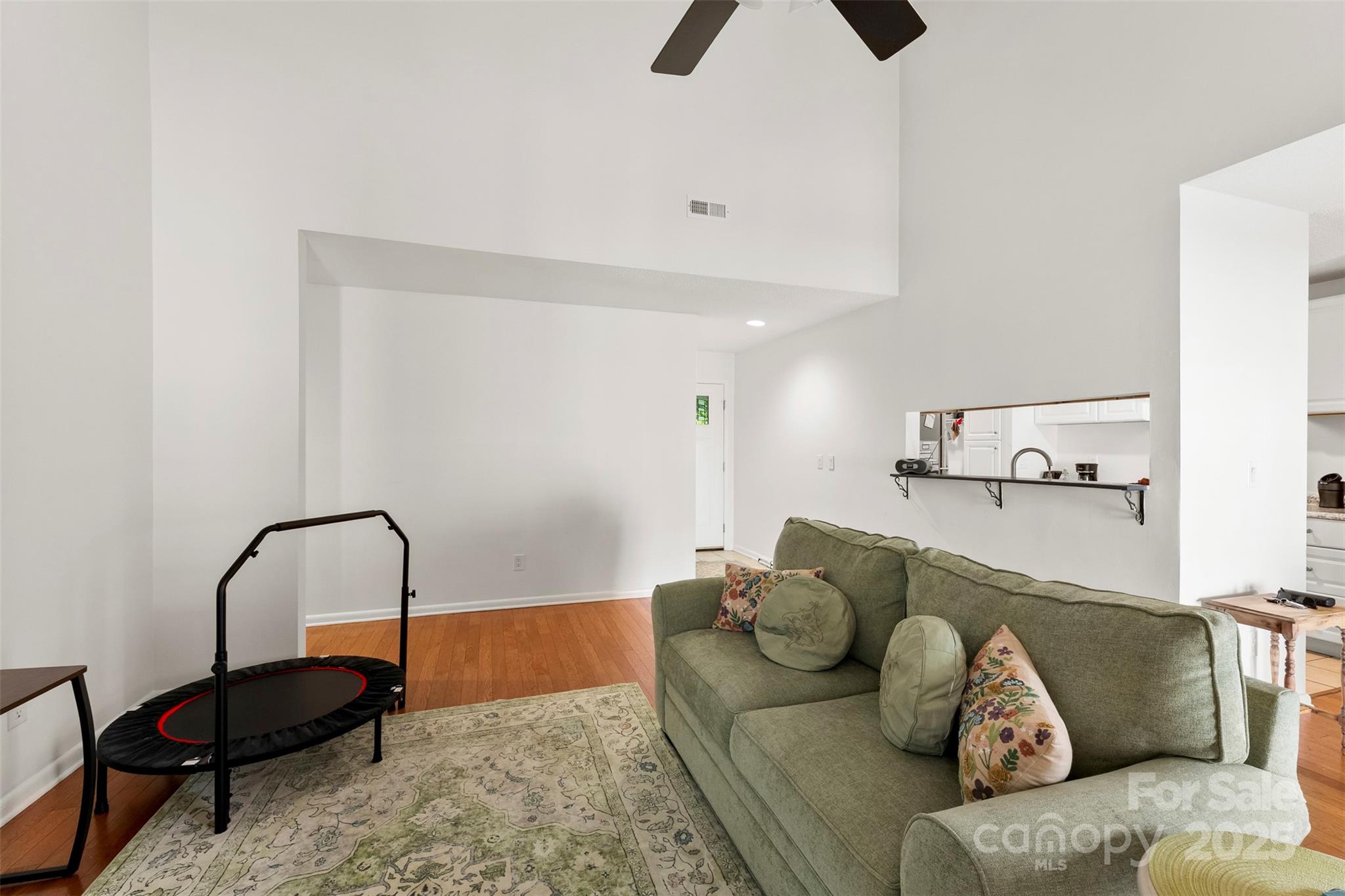 2836 Huntingtowne Farms Lane Charlotte, NC 28210 - Photo 15 of 38 a living room with furniture and a rug