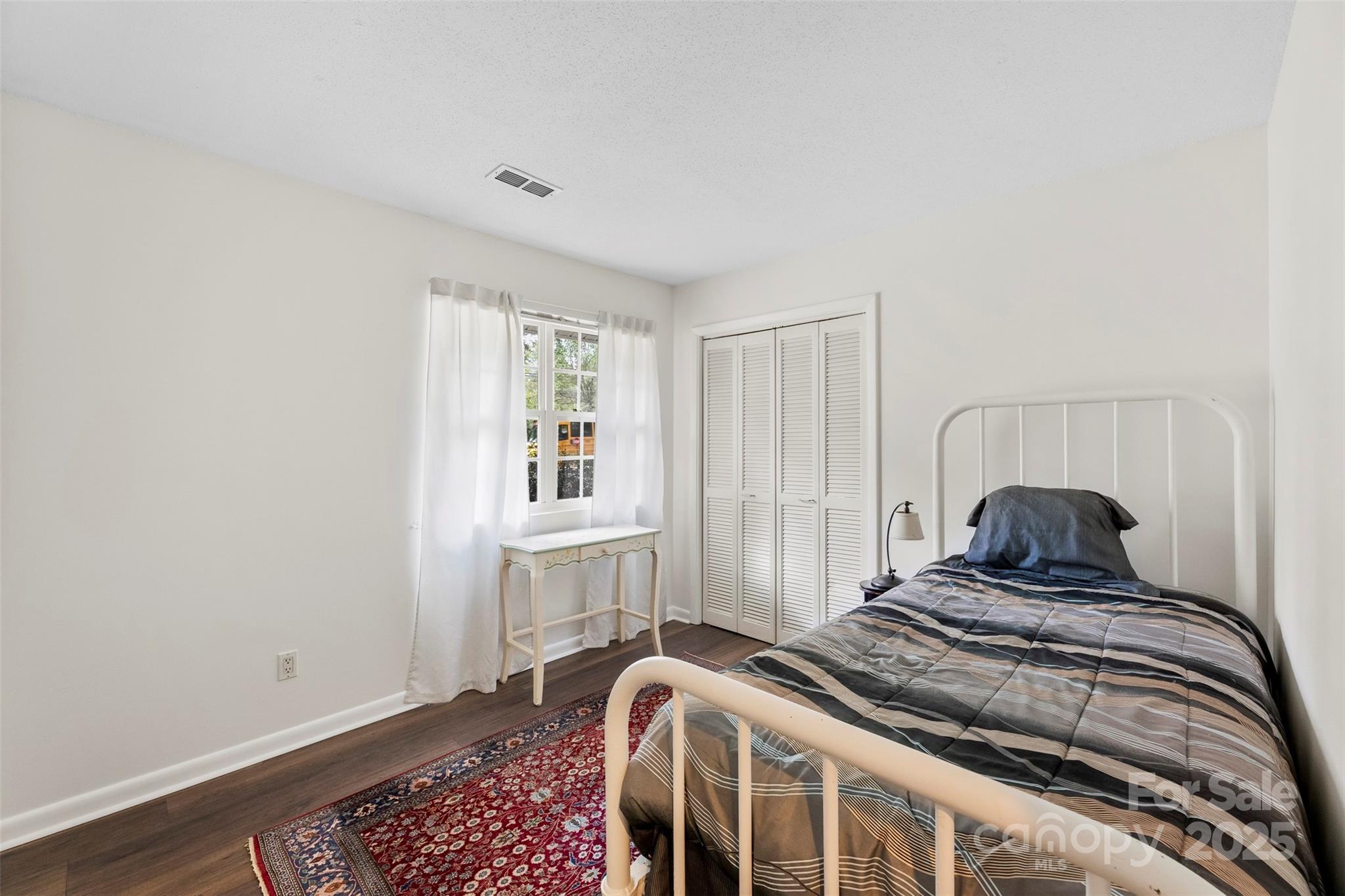 2836 Huntingtowne Farms Lane Charlotte, NC 28210 - Photo 19 of 38 a bedroom with a bed and window