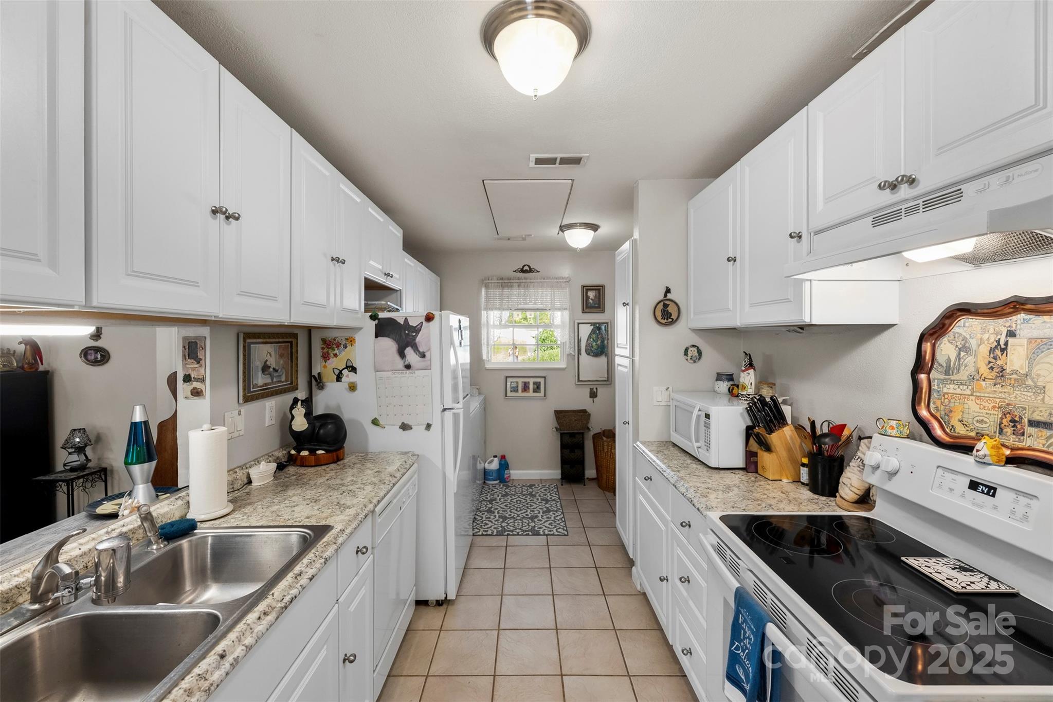 2836 Huntingtowne Farms Lane Charlotte, NC 28210 - Photo 27 of 38 a kitchen with stainless steel appliances granite countertop a sink stove and refrigerator