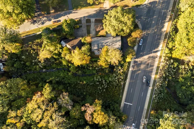 a view of a city with green field
