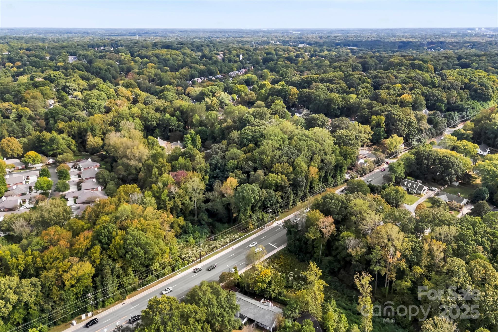 2836 Huntingtowne Farms Lane Charlotte, NC 28210 - Photo 35 of 38 a view of a city with lush green forest