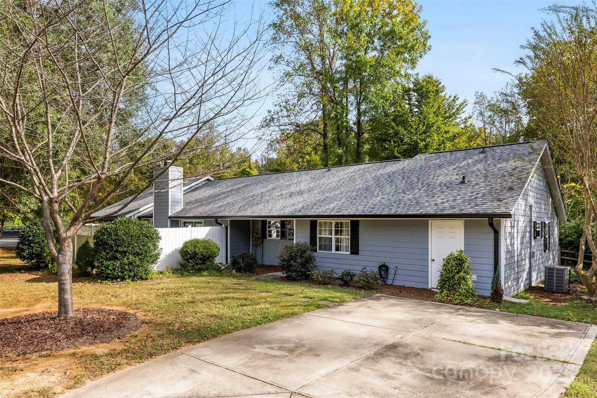 2836 Huntingtowne Farms Lane Charlotte, NC 28210 - Photo 7 of 38 a front view of a house with a garden