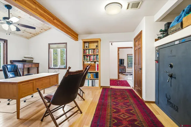 a living room with furniture and a rug