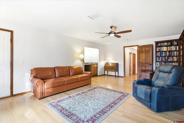 a living room with furniture rug and window