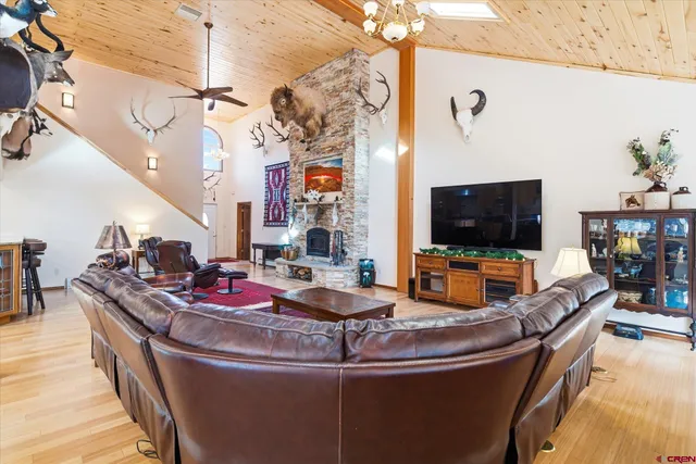 a dining room with furniture and a flat screen tv