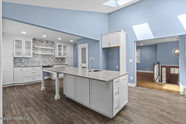a kitchen with a sink and cabinets