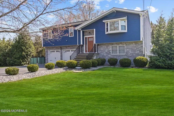 a view of a house with a backyard