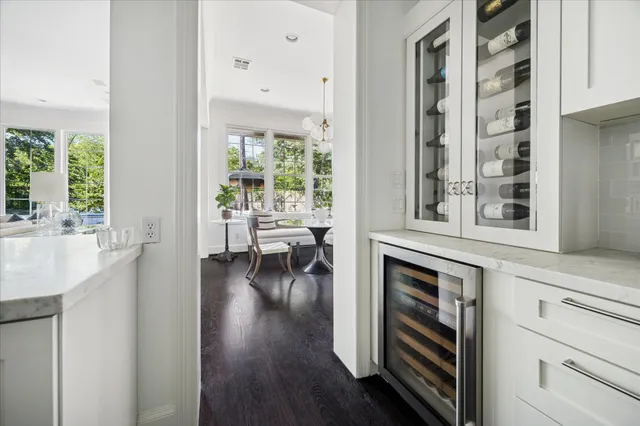 a view of a livingroom with furniture and hardwood floor