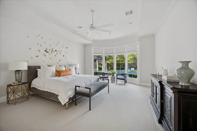 a bed room with a bed and a chair