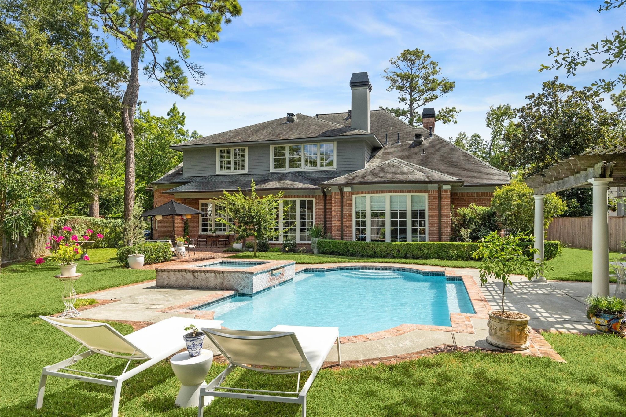 2 Blalock Pines Court Hedwig Village, TX 77024 - Photo 2 of 44 a view of a house with swimming pool and sitting area