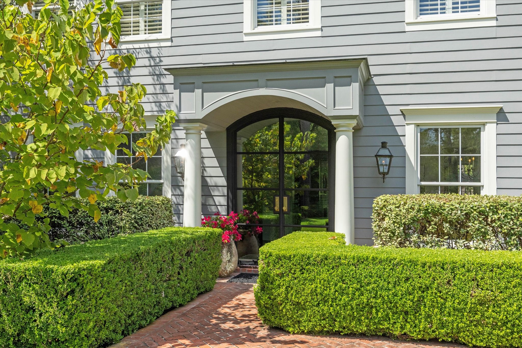 2 Blalock Pines Court Hedwig Village, TX 77024 - Photo 3 of 44 a front view of a house with garden