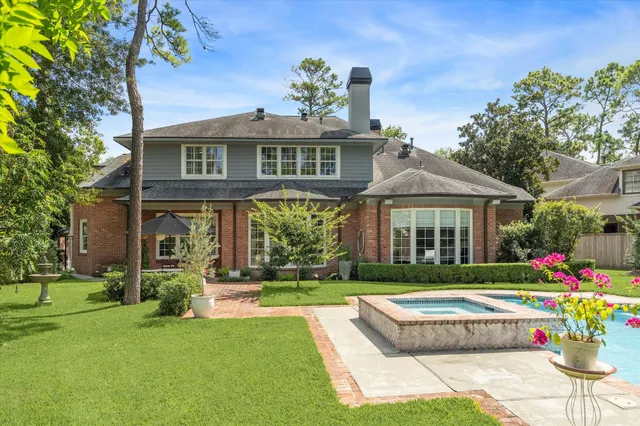 a front view of a house with a yard table and chairs