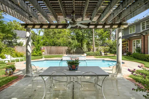 a building outdoor space with patio furniture and potted plants