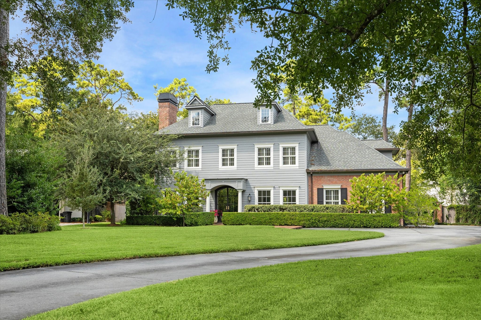 2 Blalock Pines Court Hedwig Village, TX 77024 - Photo 42 of 44 a front view of a house with a garden