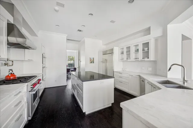 a kitchen that has a sink and a stove