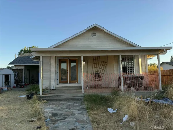 a bedroom with bed and a chandelier