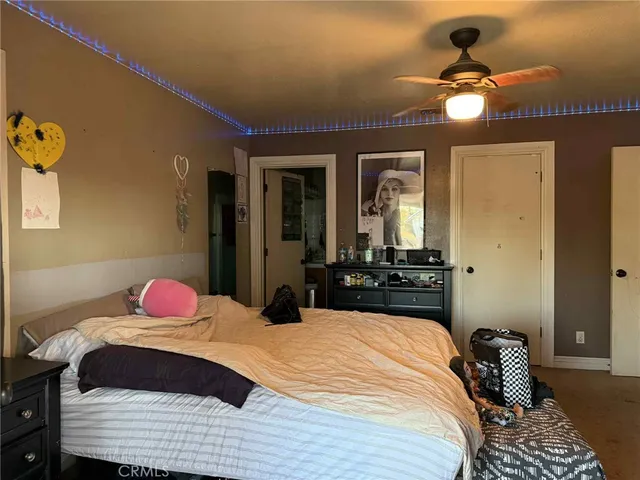 a bedroom with bed and window