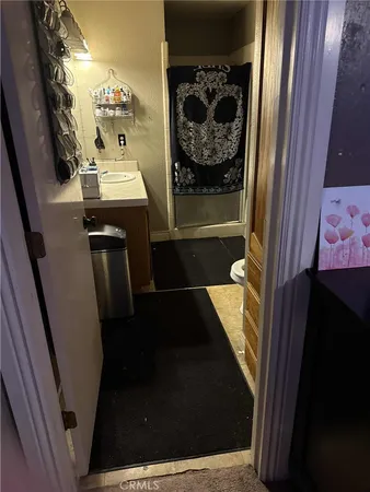 a room with hard wood and a mirror