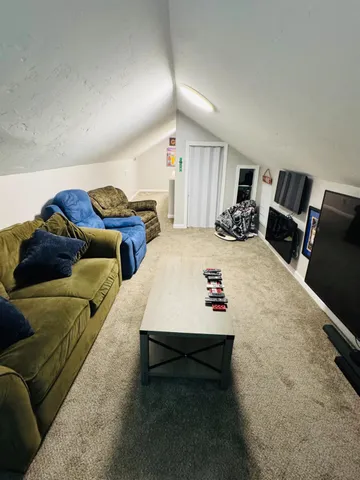 a swimming pool with lawn chairs