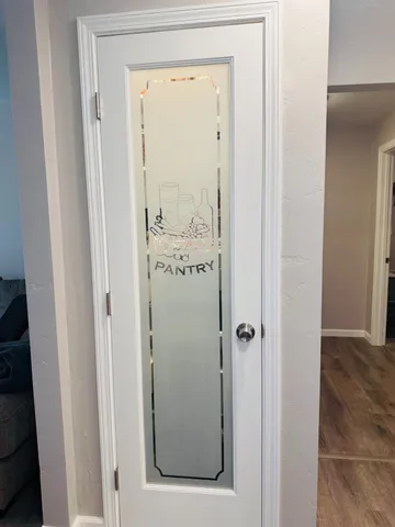 a bathroom with a glass shower door
