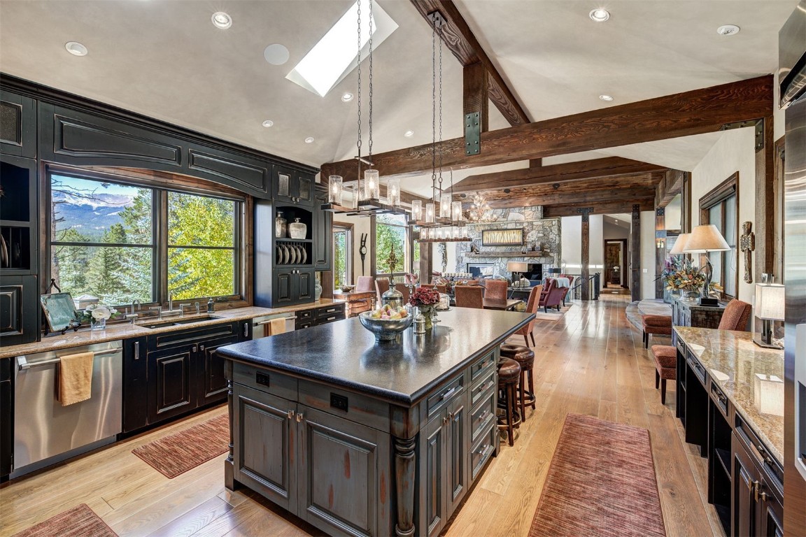 67 Rounds Road Breckenridge, CO 80424 - Photo 13 of 47 a kitchen with counter top space a sink and a large window