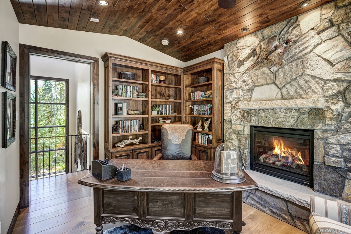 67 Rounds Road Breckenridge, CO 80424 - Photo 20 of 47 a living room with fireplace furniture and a floor to ceiling window