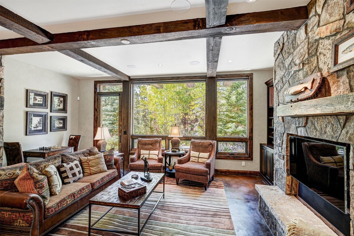 67 Rounds Road Breckenridge, CO 80424 - Photo 24 of 47 a living room with furniture and a fireplace