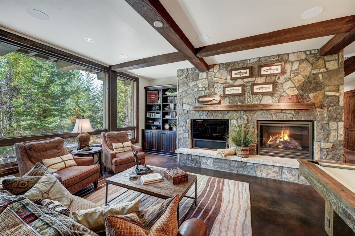 67 Rounds Road Breckenridge, CO 80424 - Photo 25 of 47 a living room with furniture and a fireplace