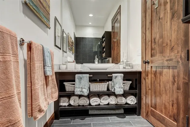 a kitchen with stainless steel appliances granite countertop a stove and a refrigerator