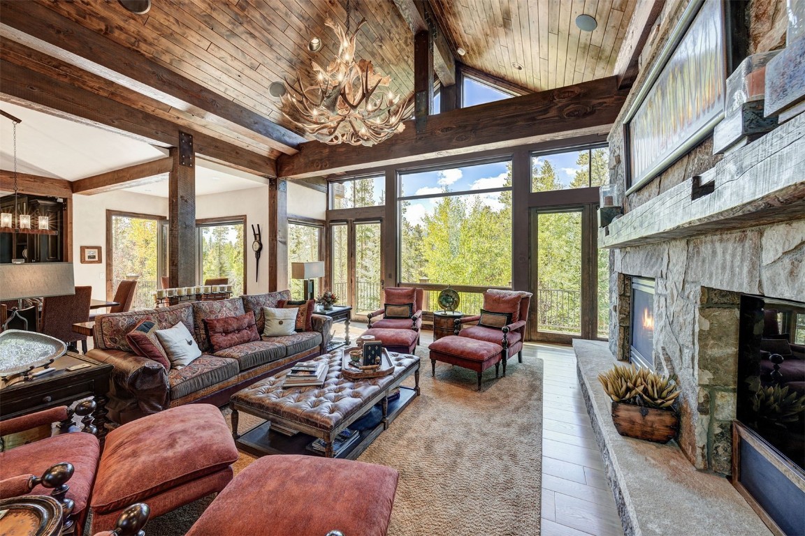 67 Rounds Road Breckenridge, CO 80424 - Photo 5 of 47 a living room with furniture a fireplace and a large window