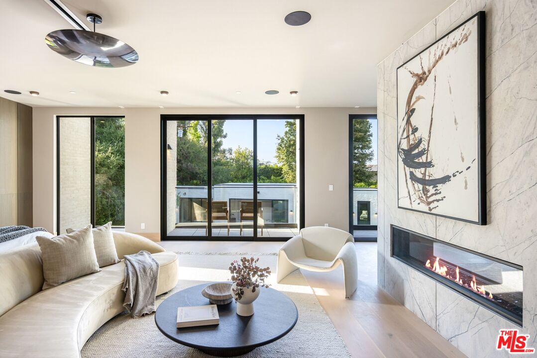 17055 Rancho Street Encino, CA 91316 - Photo 57 of 73 a living room with furniture and a large window