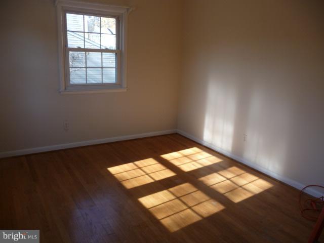 625 Cleveland Road Linthicum Heights, MD 21090 - Photo 11 of 28 an empty room with wooden floor