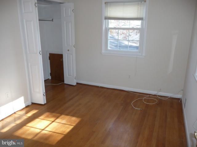 625 Cleveland Road Linthicum Heights, MD 21090 - Photo 13 of 28 a view of a room with wooden floor and small space