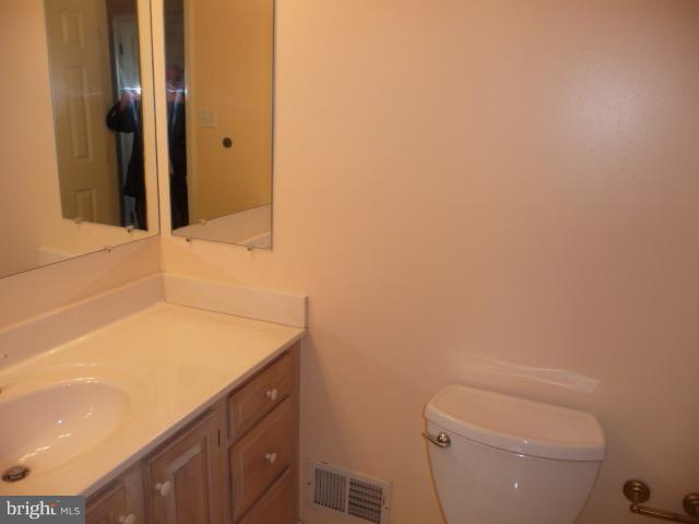 625 Cleveland Road Linthicum Heights, MD 21090 - Photo 19 of 28 a bathroom with a sink a toilet and shower