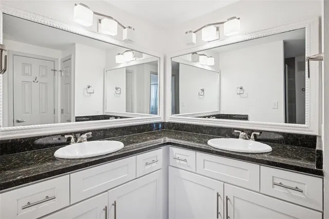 a bathroom with sink granite and a sink