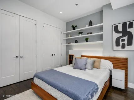 a bedroom with a bed and closet