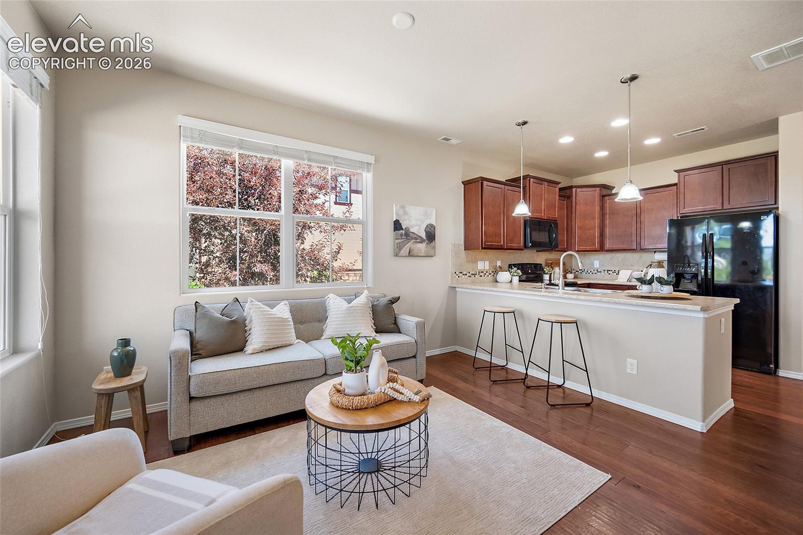5348 Prominence Point Colorado Springs, CO 80923 - Photo 2 of 29 Family Room with City and Mountain Views