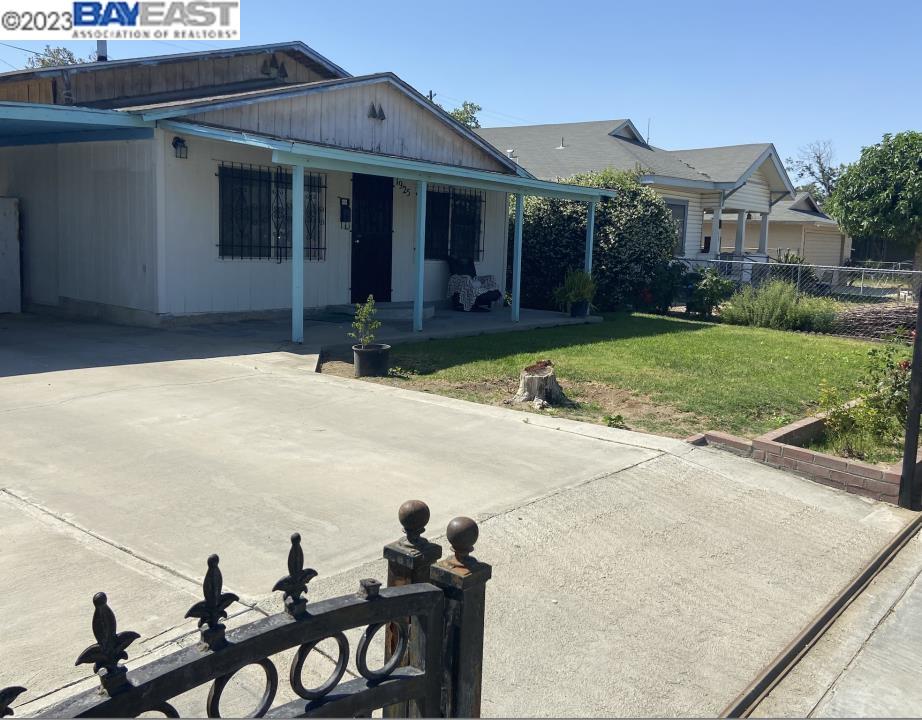1925 D Street Wasco, CA 93280 - Photo 1 of 1 a view of a house with backyard and garden