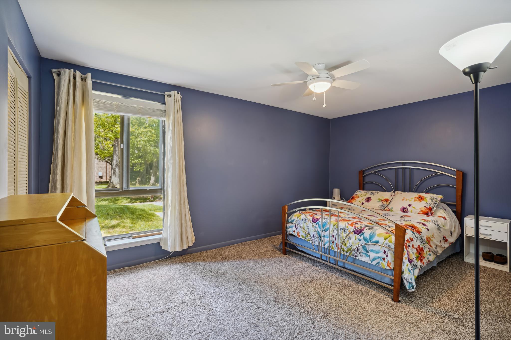 11204 Chestnut Grove Square, Unit 11204108 Reston, VA 20190 - Photo 16 of 40 a bedroom with a bed and a window