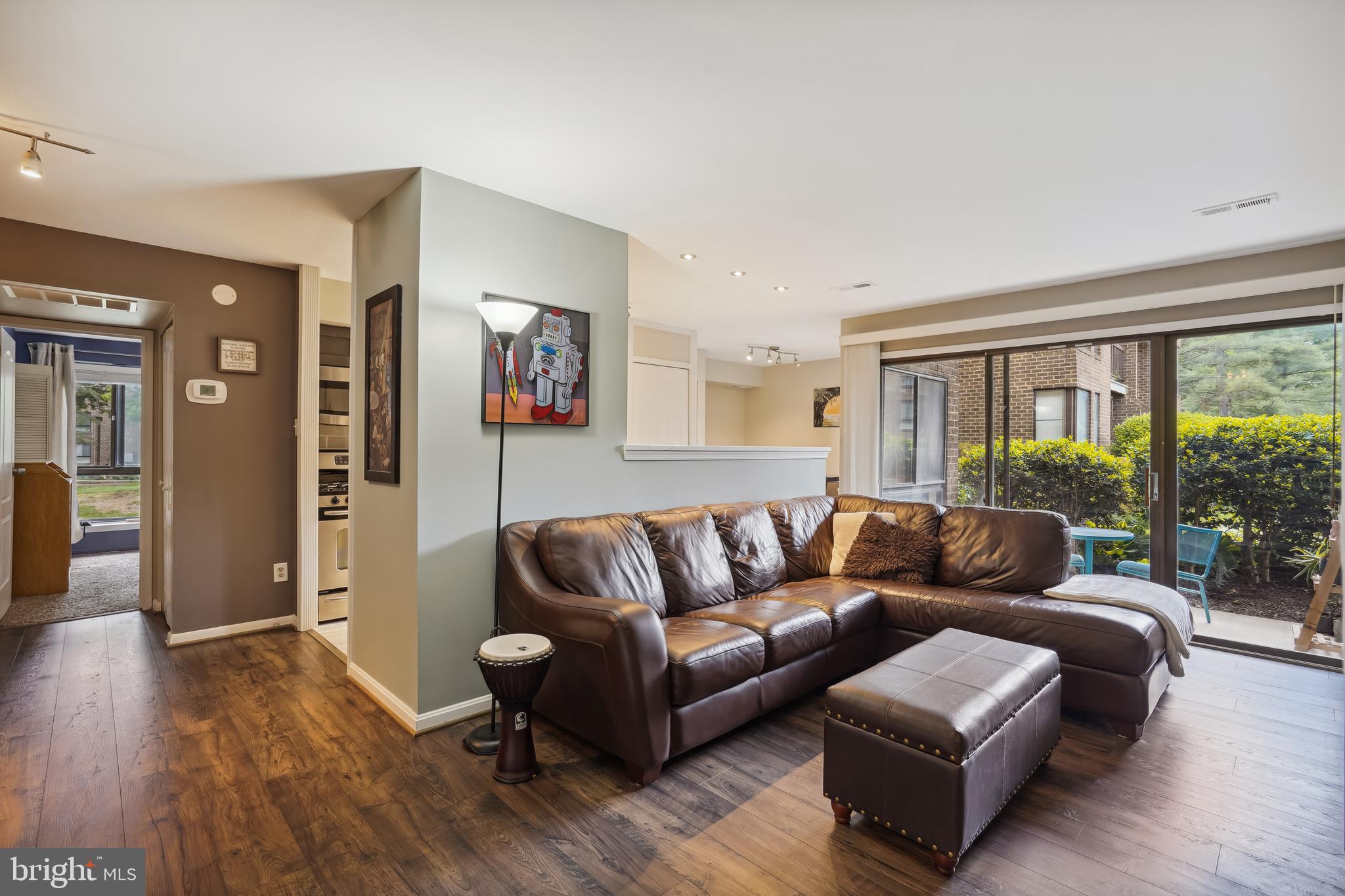 11204 Chestnut Grove Square, Unit 11204108 Reston, VA 20190 - Photo 8 of 40 a living room with furniture and a large window