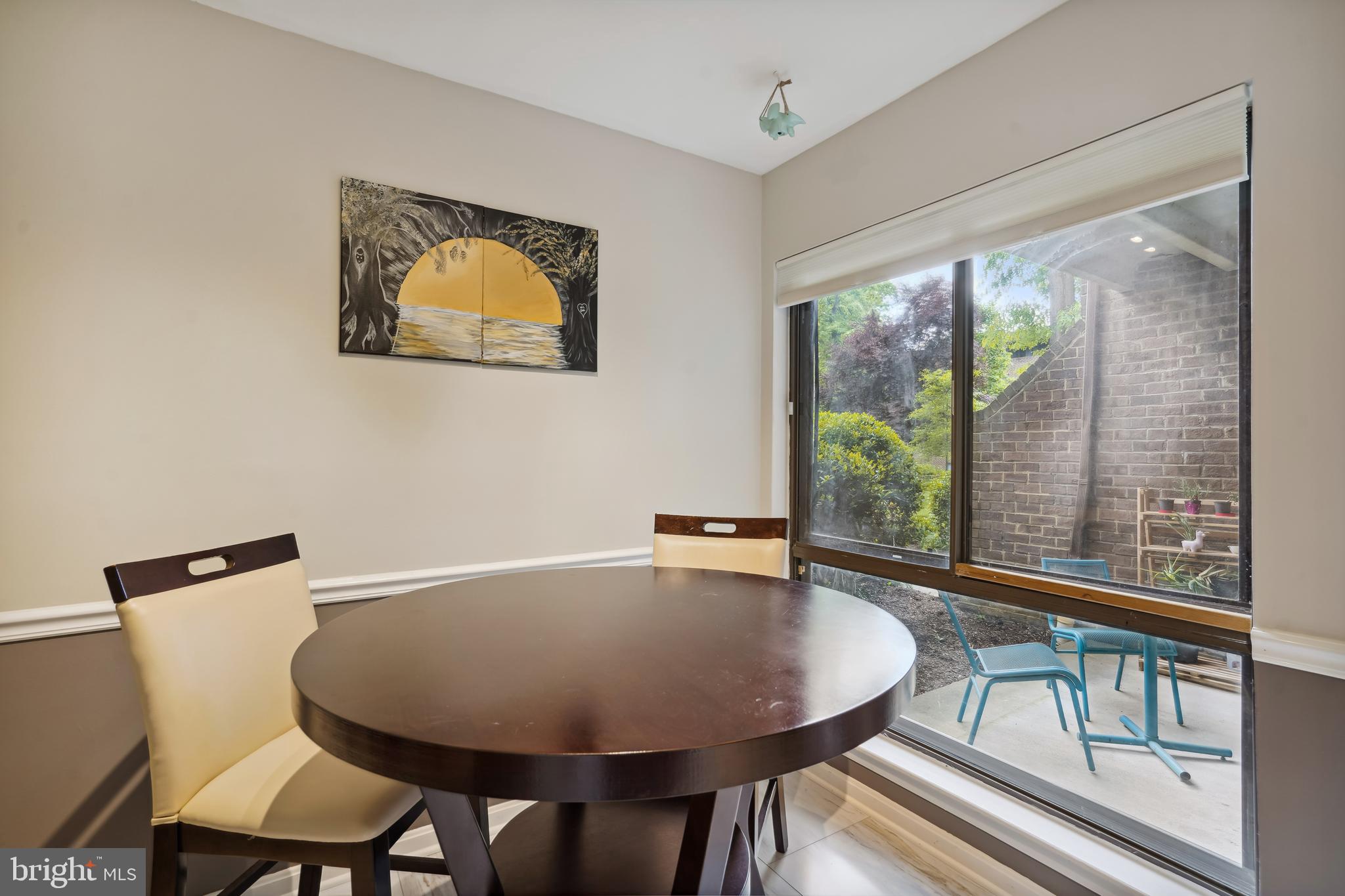 11204 Chestnut Grove Square, Unit 11204108 Reston, VA 20190 - Photo 10 of 40 a view of a dining room with furniture window and outside view