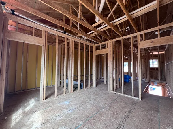 a view of a room with furniture and windows