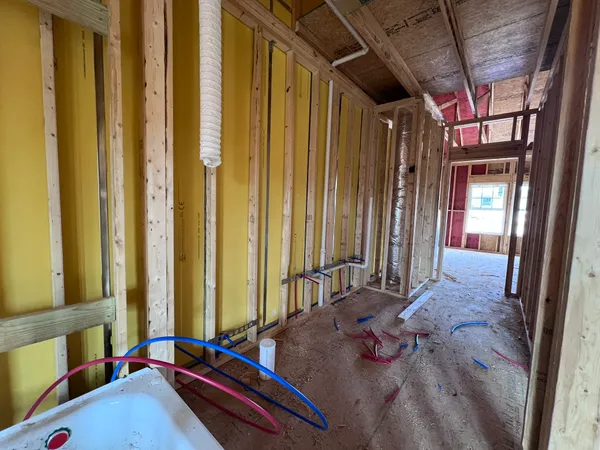 a view of an empty room with wooden walls