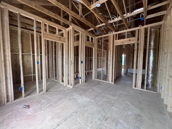 a view of a room with a furniture and floor to ceiling window